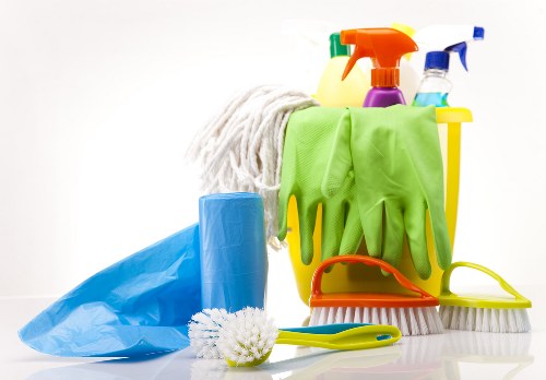 Carpet cleaning technician preparing safe equipment for use